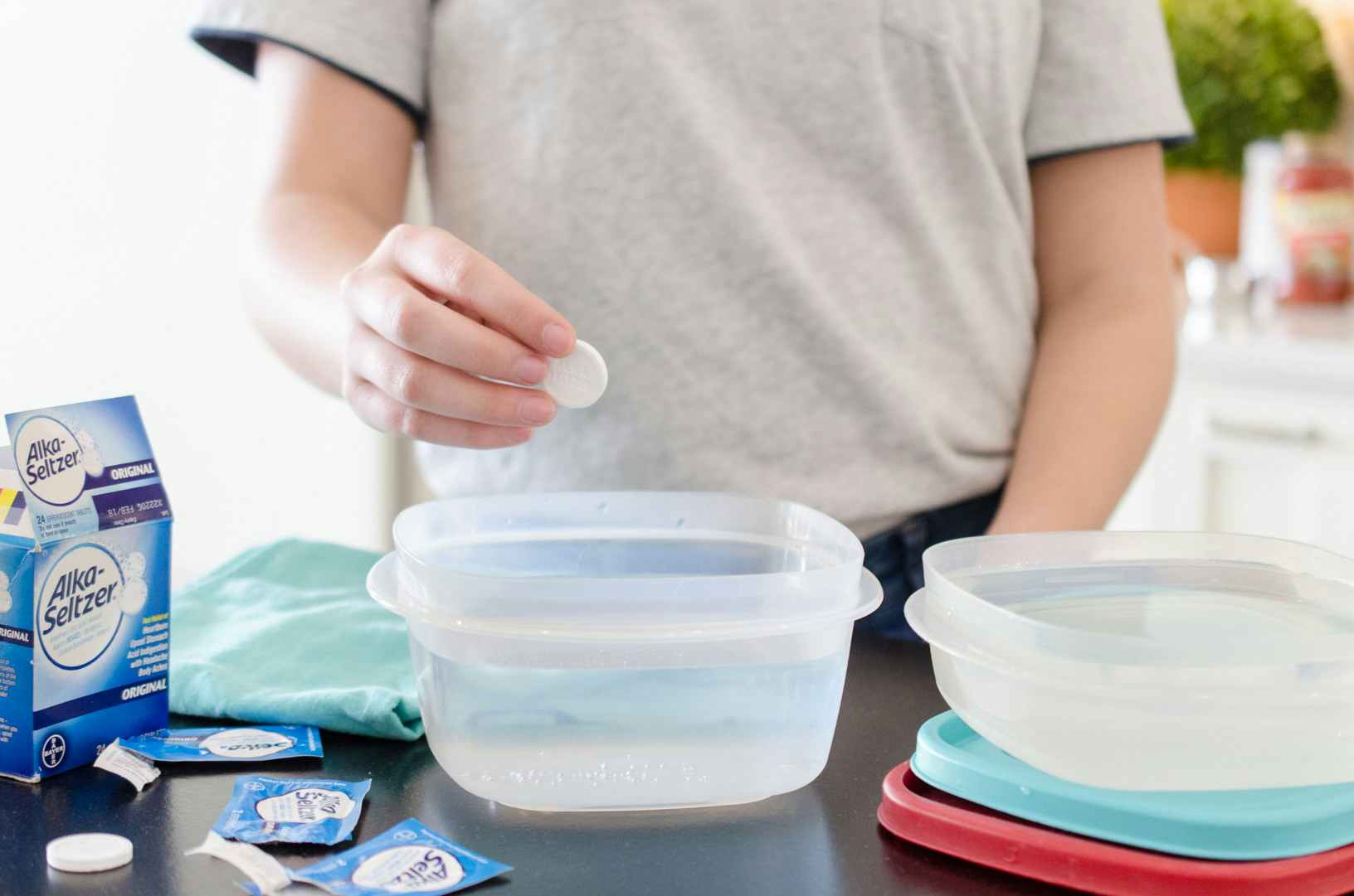Remove stain from plastic containers.