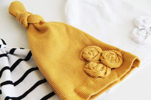 Make a baby beanie from upcycled t-shirts and save $2 each hat.