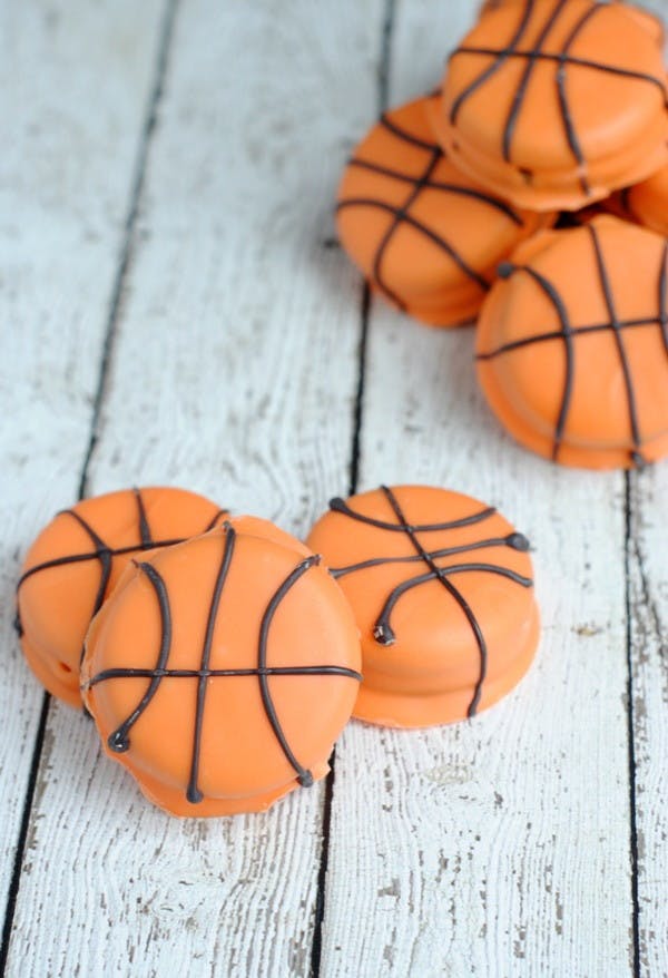 Coat Oreos in candy melts for edible basketballs.