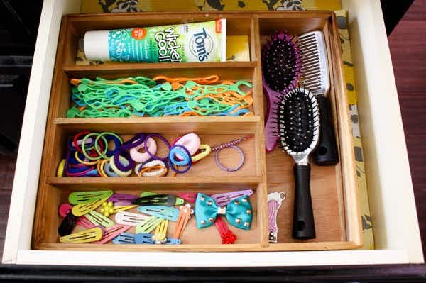 Store bathroom necessities in a cutlery organizer.