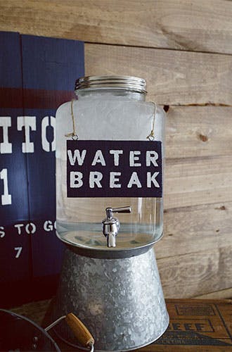 Make a water break sign with chalkboard paint and a pen.