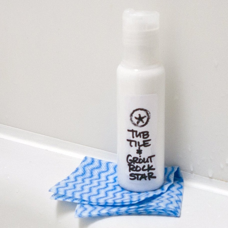 Whiten grout and clean tile by mixing together baking soda, hydrogen peroxide, and dish soap.