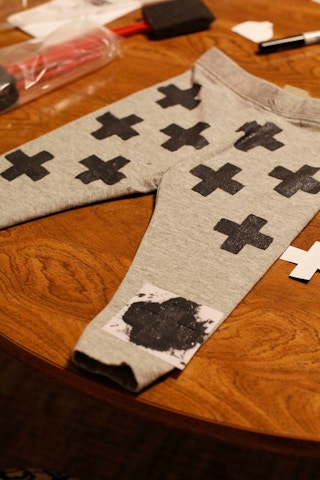 Use a stencil and fabric paint to make printed leggings to save $5-$10 each.