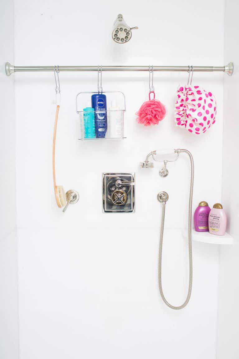 Use a tension rod to organize and declutter your shower.