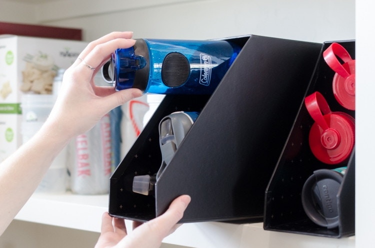 Turn magazine files into water bottle and canned food holders.