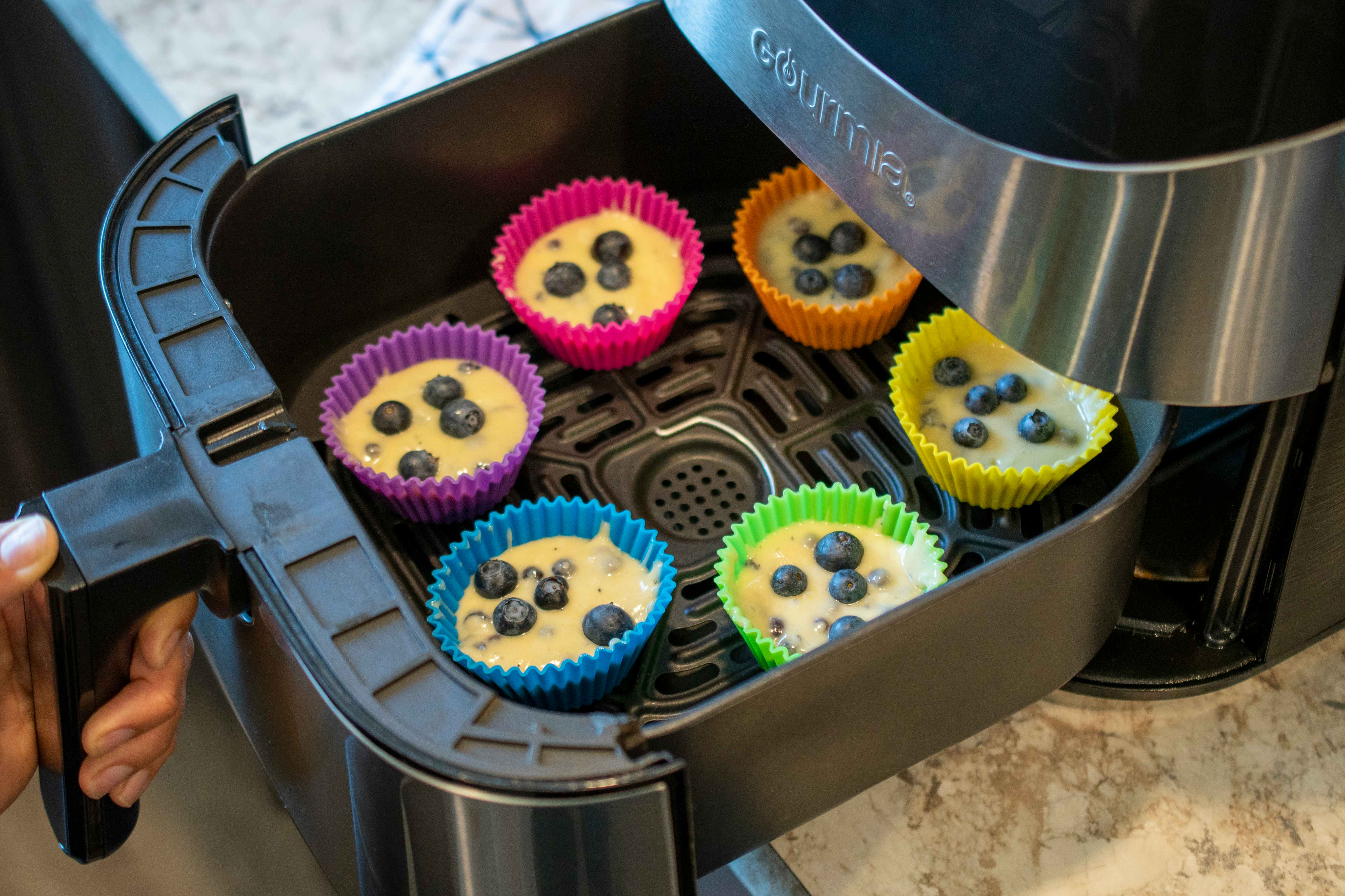 muffin batter in silicone muffin cups, in an air fryer 