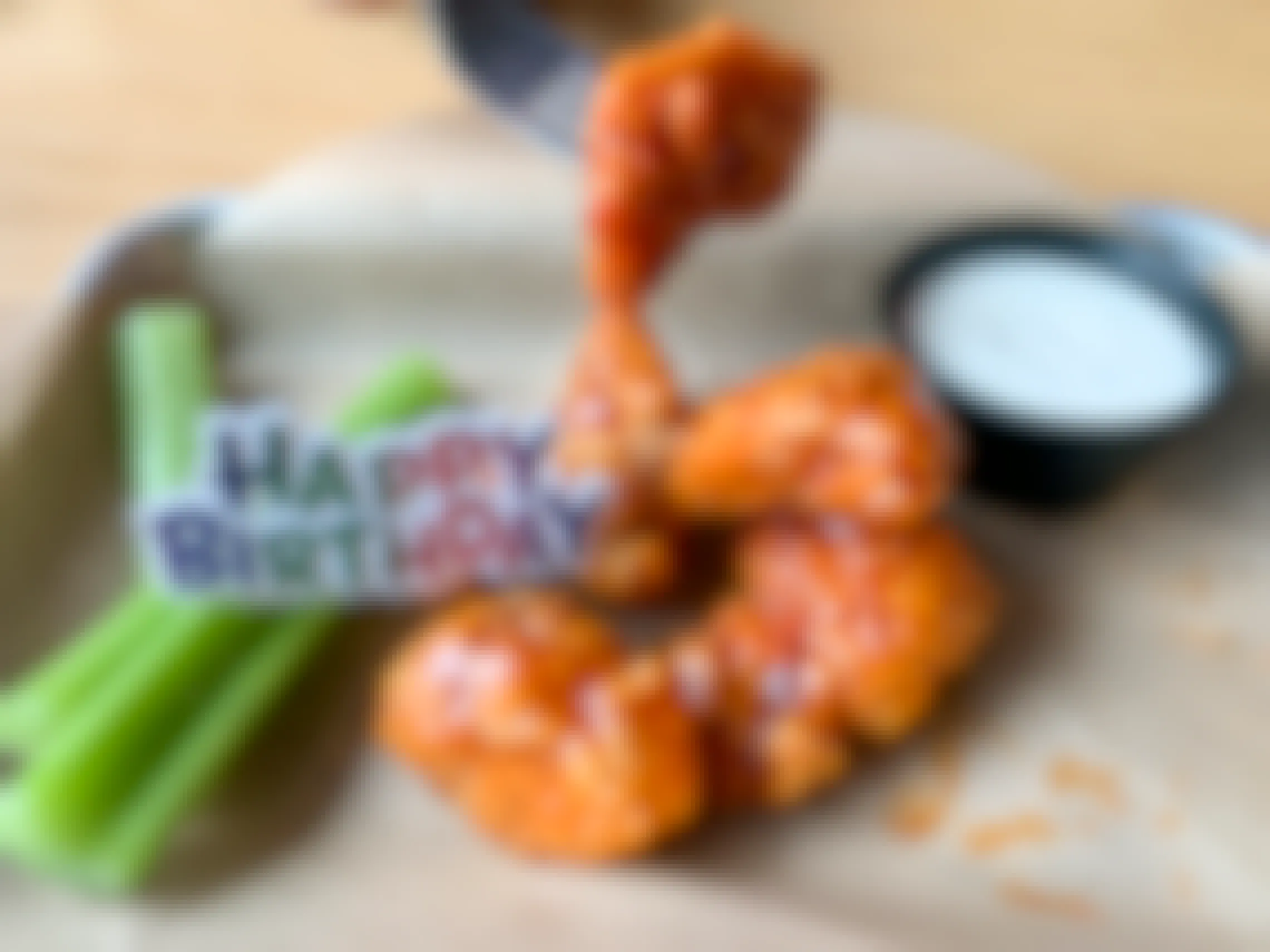 A free Birthday snack size plater of boneless buffalo wings with a plastic Happy Birthday tag on top of it.