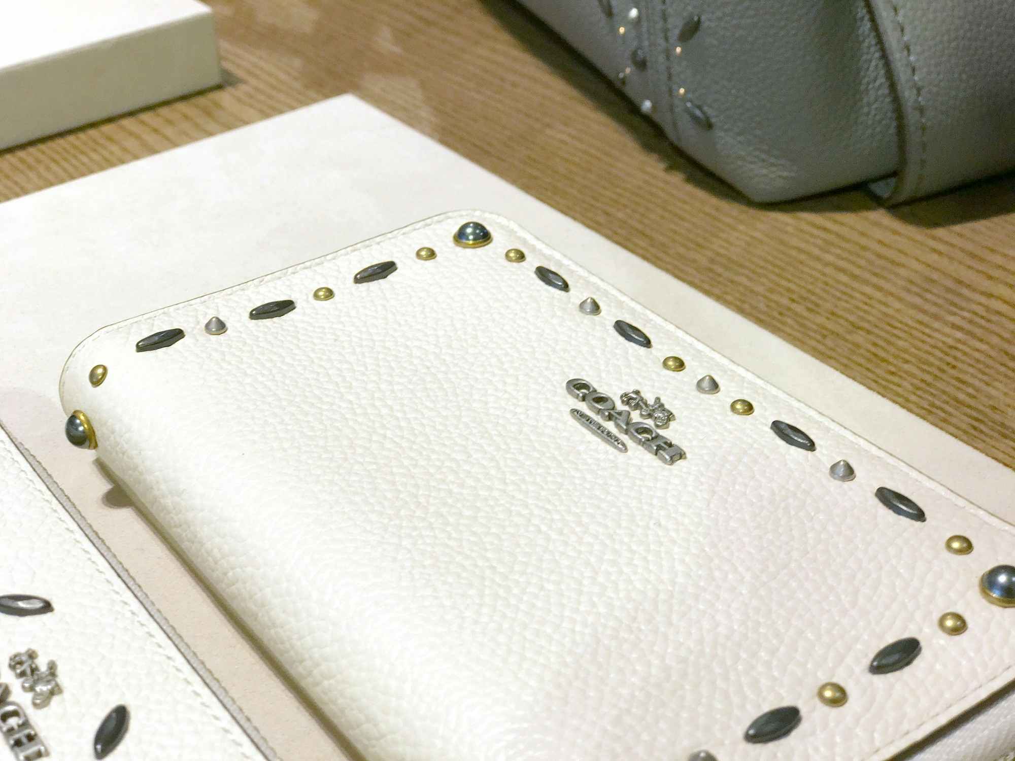 close up view of an authentic white coach wallet