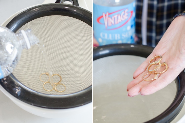 Someone using sodium-free club soda to clean gold rings
