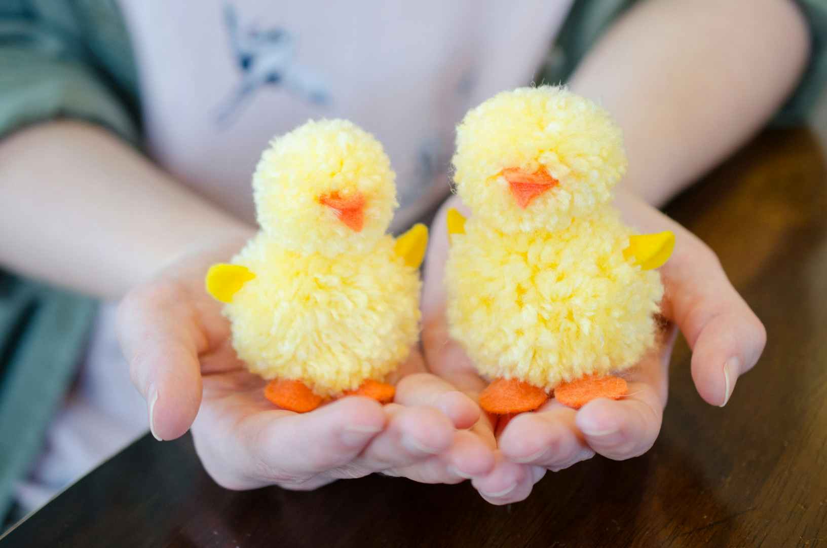Make pom poms into Easter chicks.
