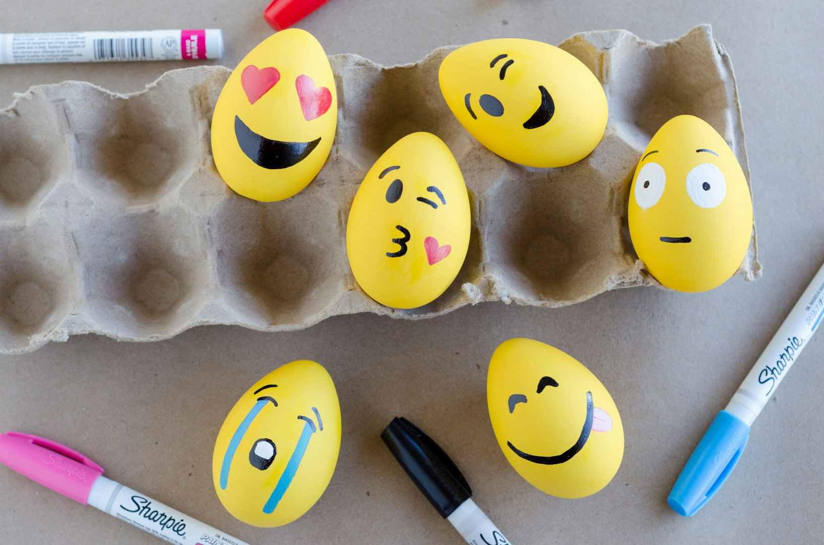 Make emoji Easter eggs with paint and markers.