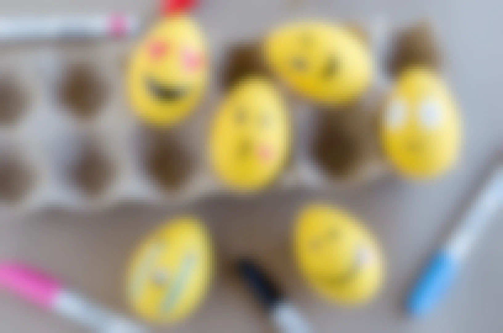 Make emoji Easter eggs with paint and markers.