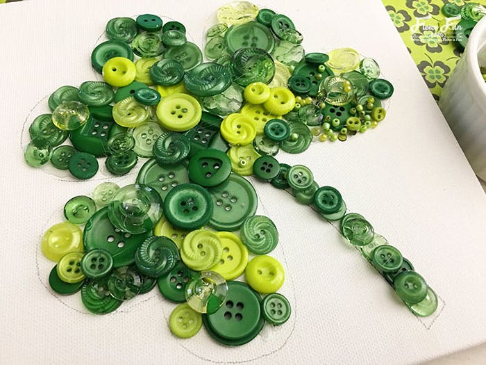 Make a St. Patrick's Day clover out of buttons and beads.