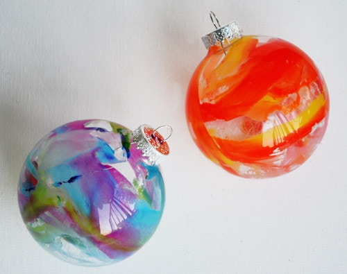 Melt crayons inside a clear glass ornament.