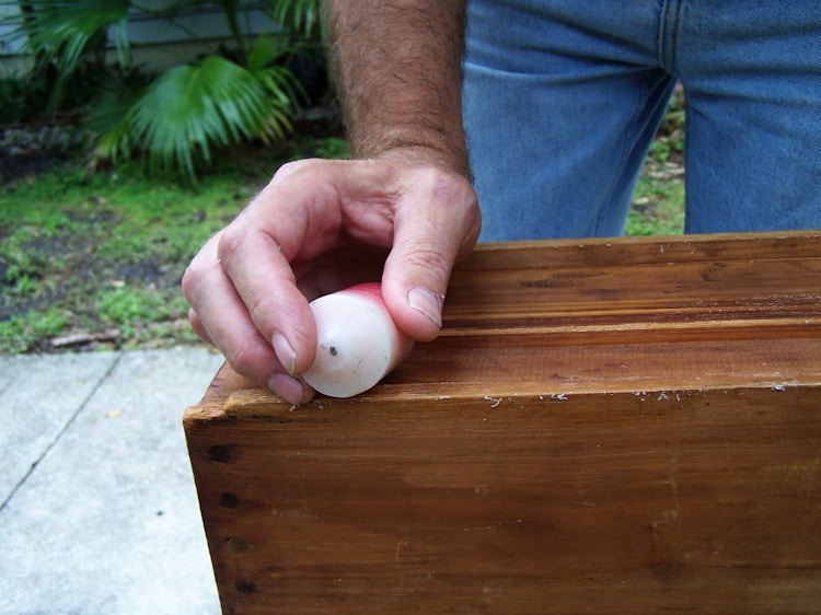 Use old candle wax to prevent squeaky or stuck drawers.
