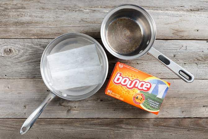 Put a dryer sheet in a greasy pan with water for a no-scrub clean.