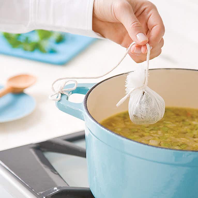 Flavor soup with removable herbs.