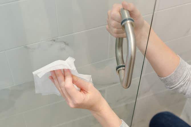 Get rid of hard water stains on a shower door.