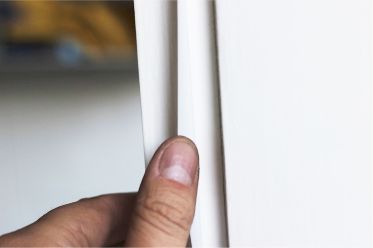 Use white candle wax in place of caulk to seal drafty windows.