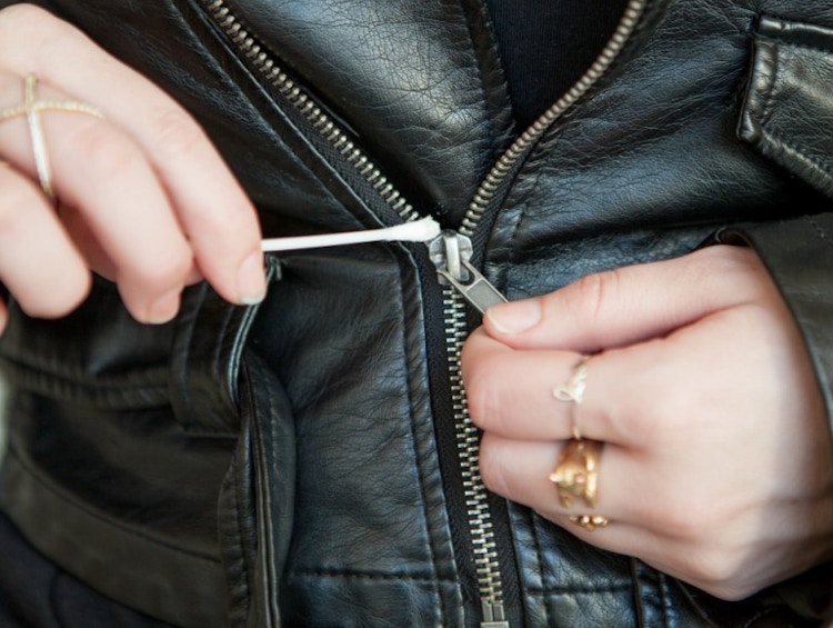 Dab a drop of shampoo on a stuck zipper.