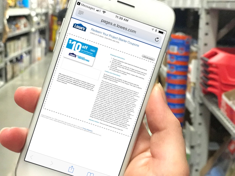 someone holding phone displaying a Lowe's coupon page