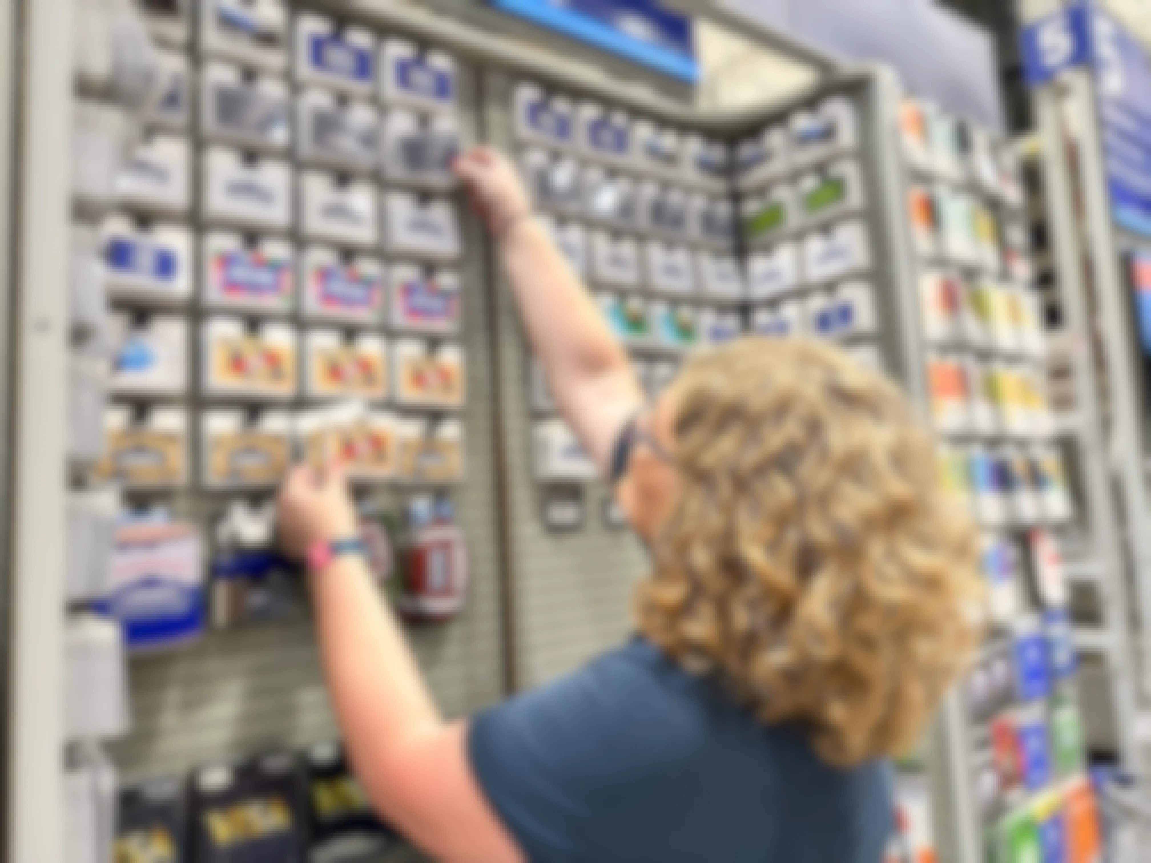 a woman shopping for lowes gift cards in store 
