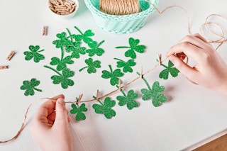 Someone putting together a DIY clover garland