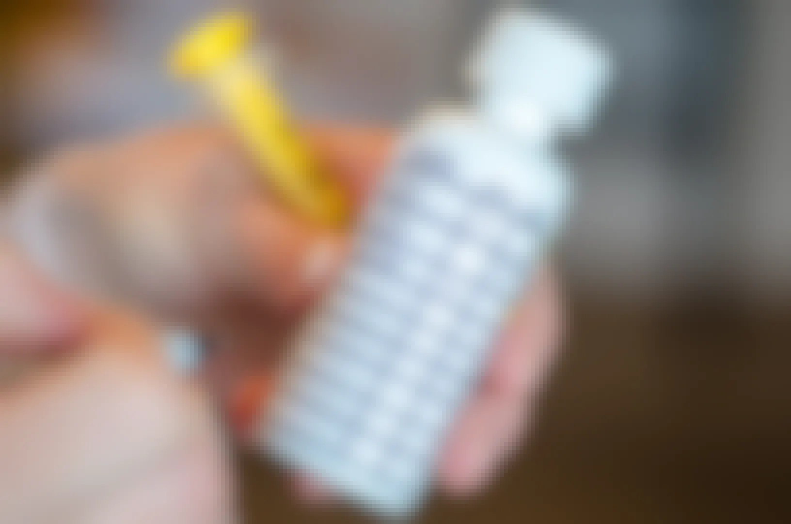 liquid pain reliever bottle with tracking chart