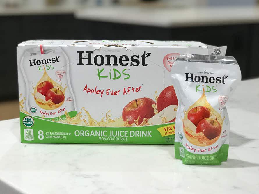 A box of Honest Kids juice pouches on a kitchen counter.