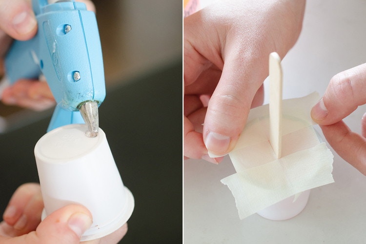 A person hot gluing a hole in the bottom of a K-cup next to person putting tape and a popsicle stick in an empty K-cup.
