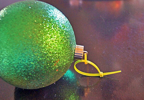 Hang ornaments with zip ties.