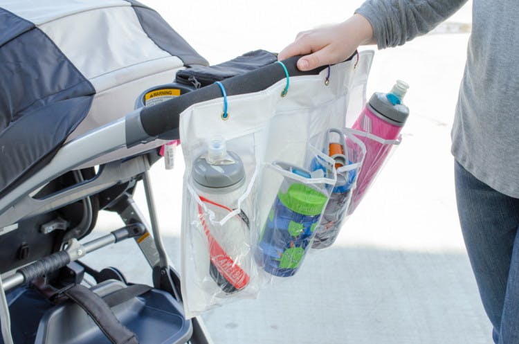 Attach a shoe organizer to a stroller to hold drinks for the whole family.
