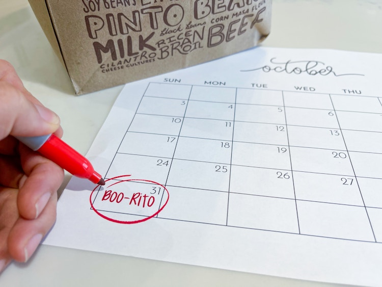 someone circling boorito on calendar