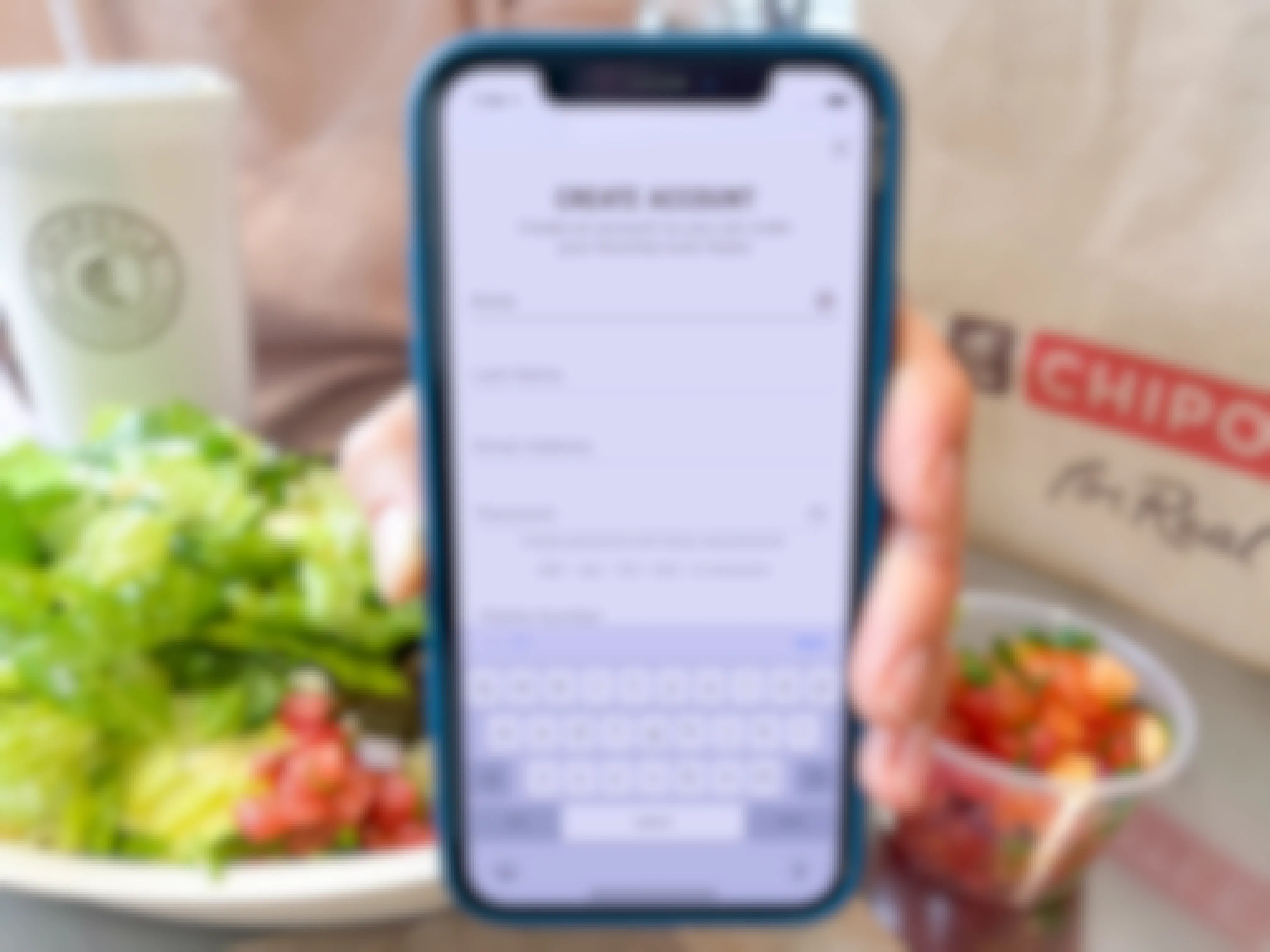 someone holding phone with chipotle app