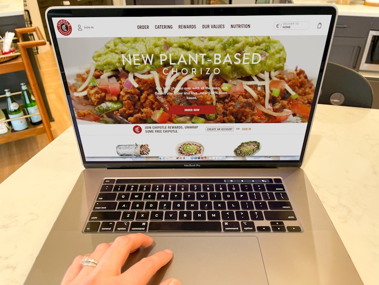 someone on computer open to chipotle
