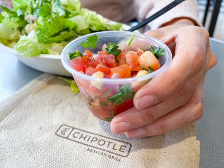 someone holding salsa