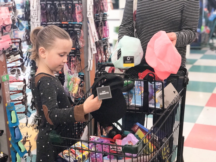 girl looking at hats