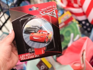 someone holding disney cars nightlight