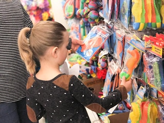 girl looking at pool toys