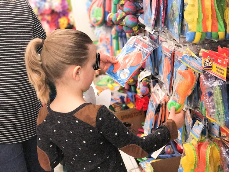 girl looking at pool toys