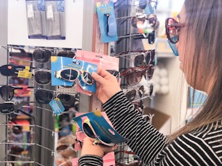 someone looking at sunglasses