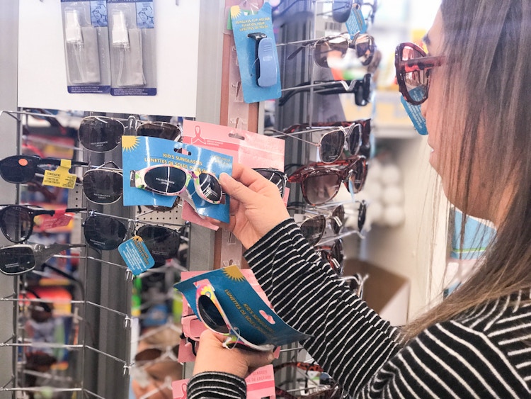 someone looking at sunglasses