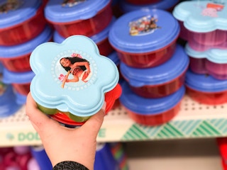 someone grabbing disney travel container