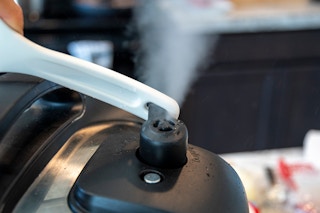 quick release vent on instant pot with handle of spoon