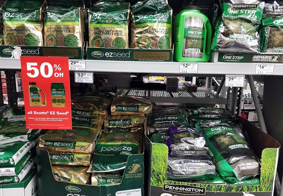 A shelf stocked with grass seed.