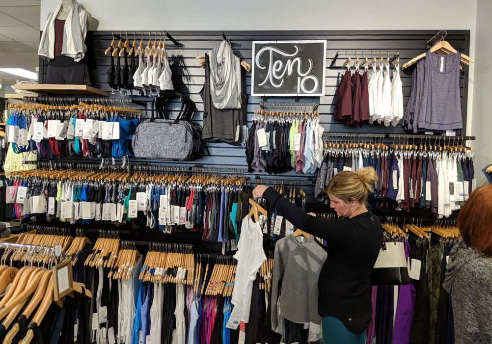A woman shopping in the Lululemon outlet store.