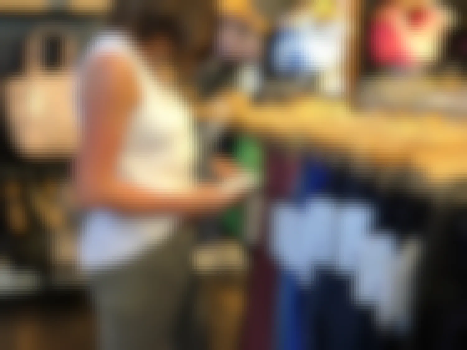 Woman looking at a leggings price tag inside the store