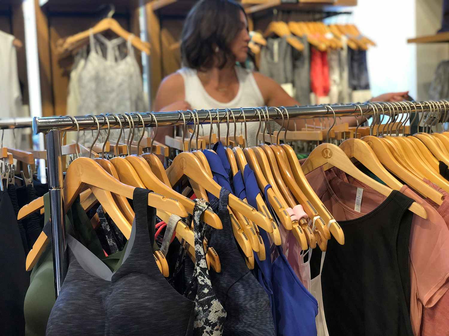 Woman looking through We Made Too Much racks inside the store