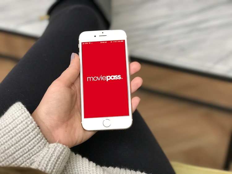 Cell phone with the MoviePass logo on the screen. MoviePass 2.0 will have an app interface too.
