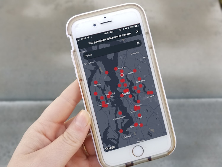 A phone displaying the MoviePass locations on a map.